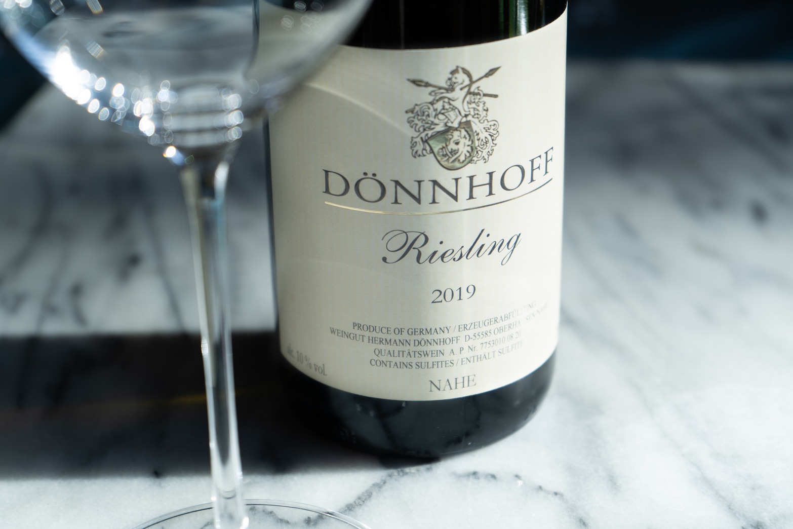 Donnhoff Estate Riesling 2019 on Marble Countertop with Wine Glass